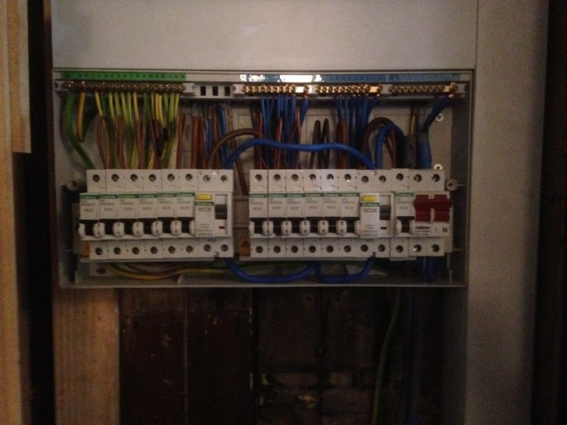 Open electrical circuit box with switches and wiring