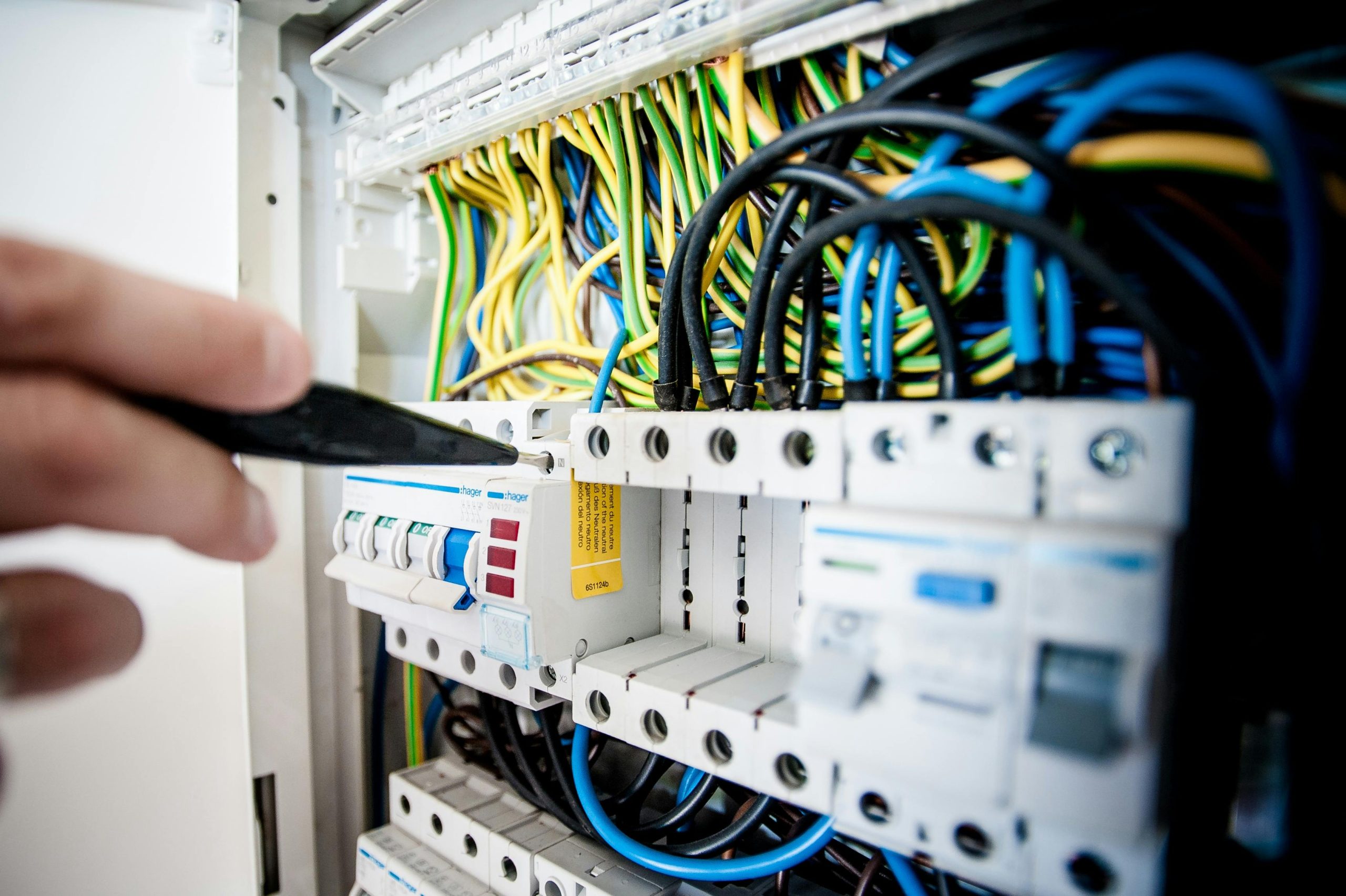 Organised circuit breaker panel with colour-coded wiring